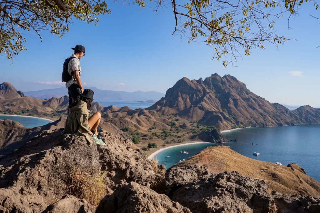 Another couple posing at Padar’s signature viewpoint spot.
