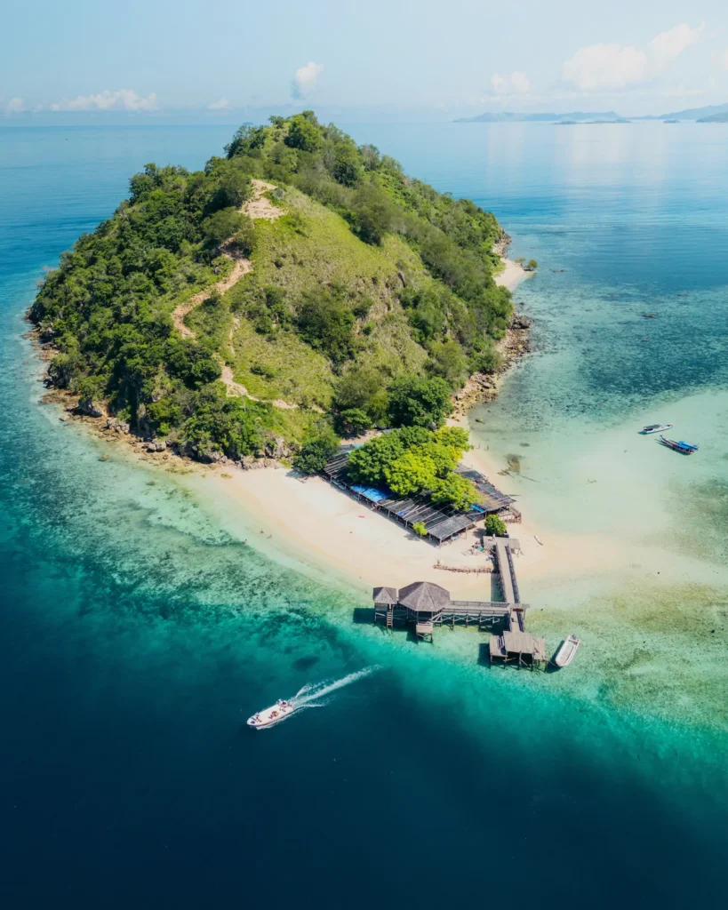 Bird’s-eye view of Kelor Island surrounded by brilliant coral reefs.