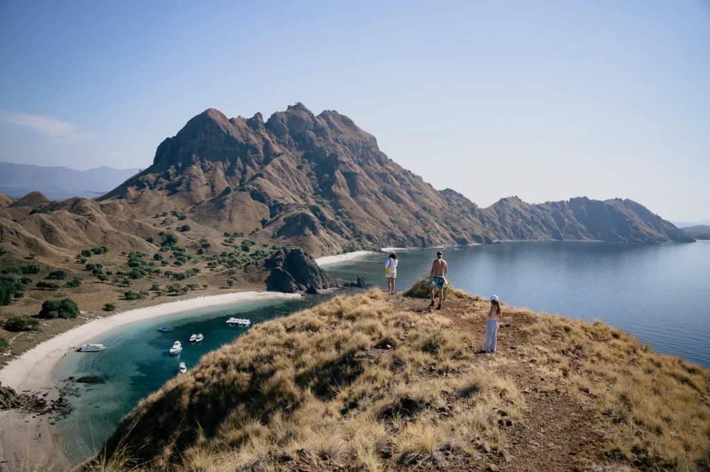 Family posing in front of Padar’s stunning split bay viewpoint.