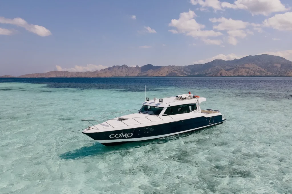 Como speedboat stationed near a pristine island, perfect for private Komodo getaways.