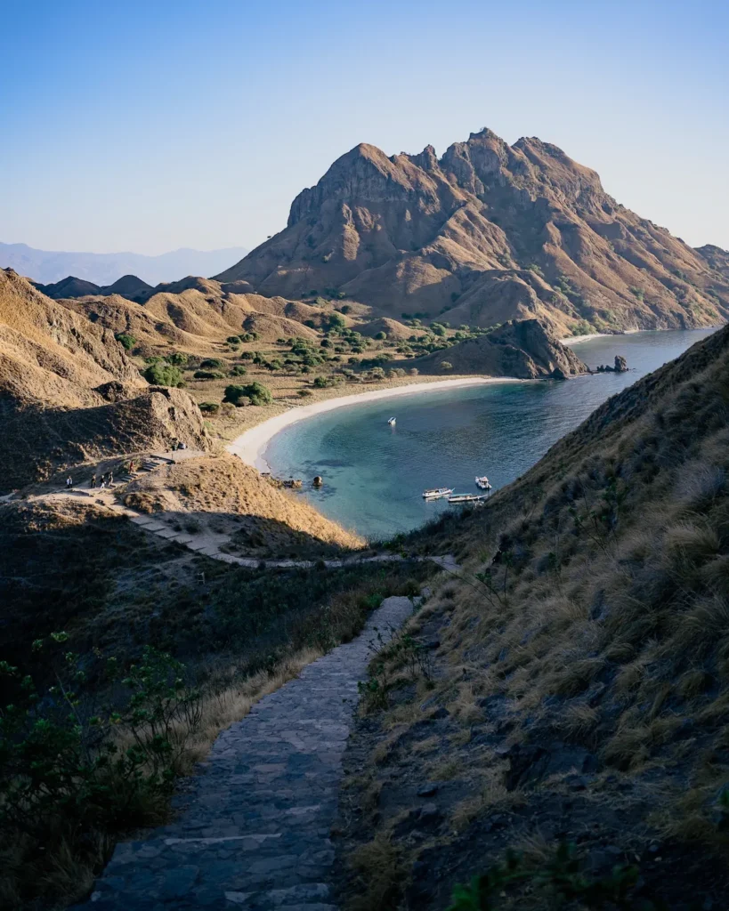 Wooden staircase leading to Padar Beach with scenic view.